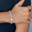 Pavé diamond tennis bracelet with clover charm in white gold