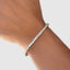 3mm yellow gold diamond tennis bracelet worn on wrist